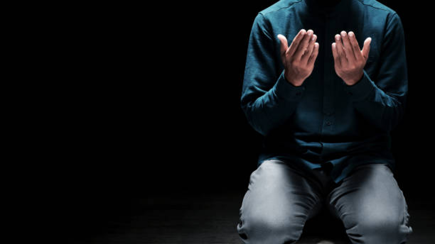 Muslim man praying in the mosque